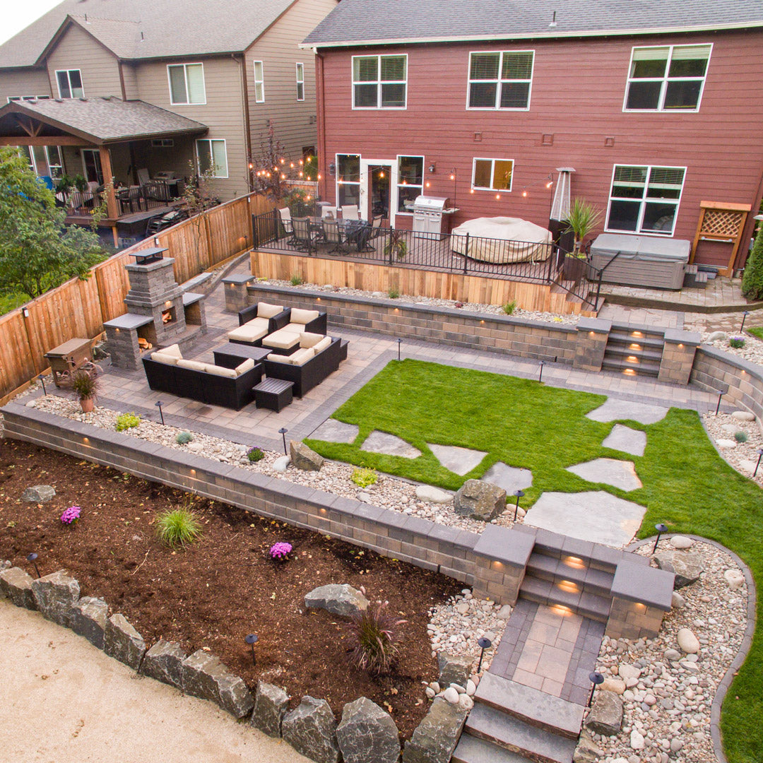 Backyard with stone fire pit, pavers and steps