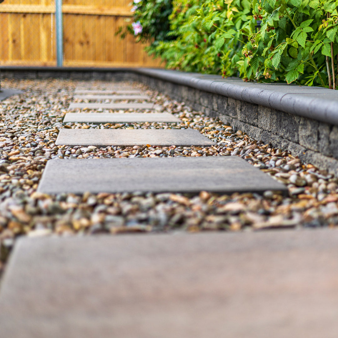 Step stone pathway on pebble ground cover