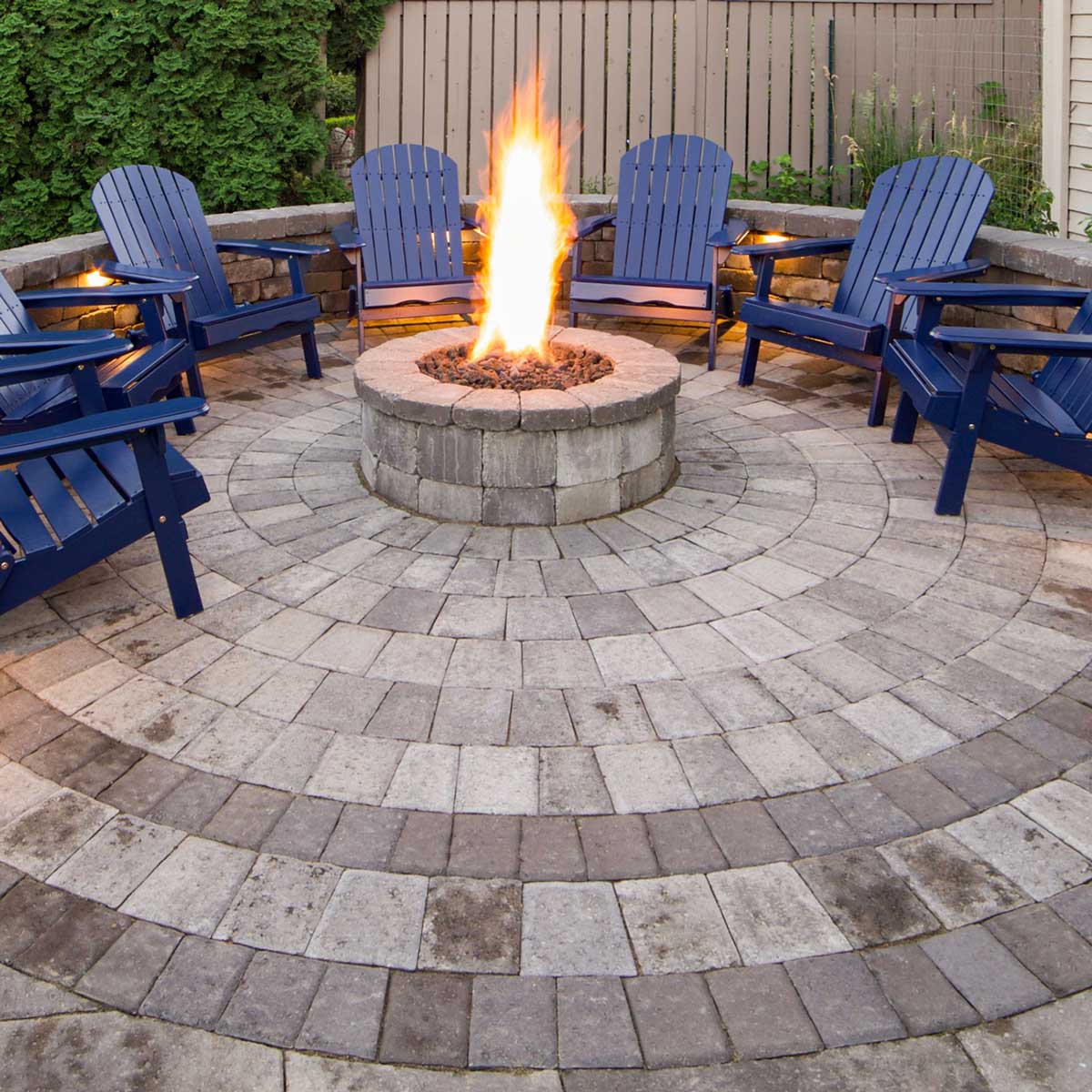 Stone Fire pit surrounded by a stone patio
