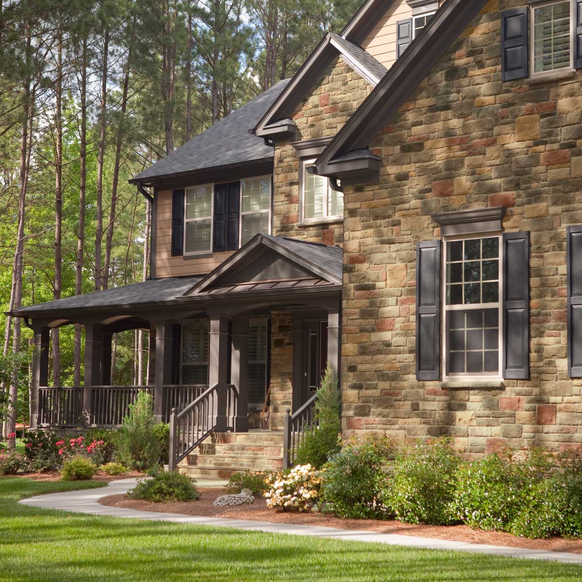 Two-story stone veneer house 